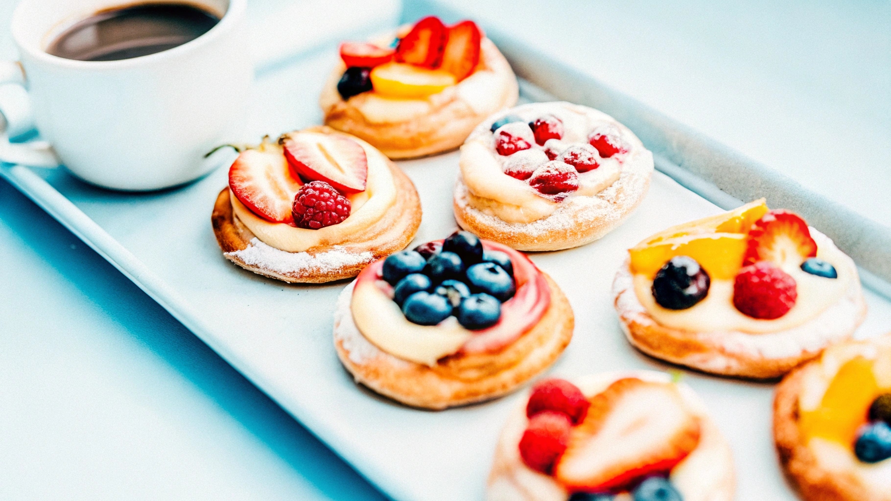 ssorted Danish pastries with fruit toppings, a delightful option for sweet breakfast ideas from around the world