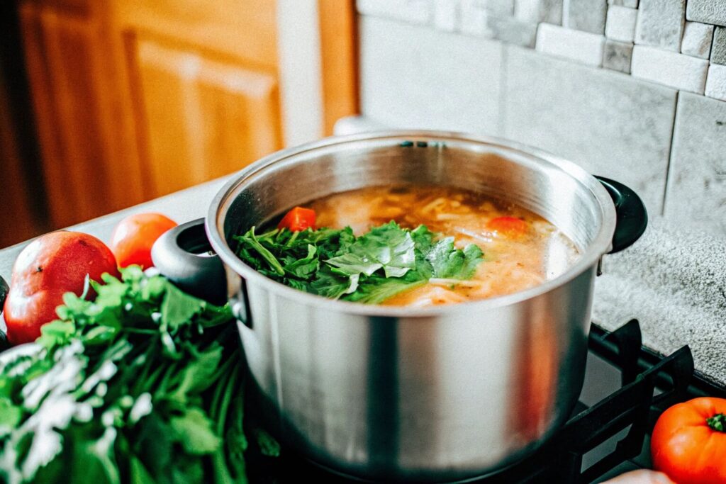 a-rustic-kitchen-with-a-pot-of-swamp-soup-cooking